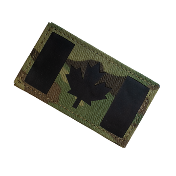 Camouflage patch with a black maple leaf on a white background