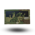 Multicam patch with a dragon design on a white background